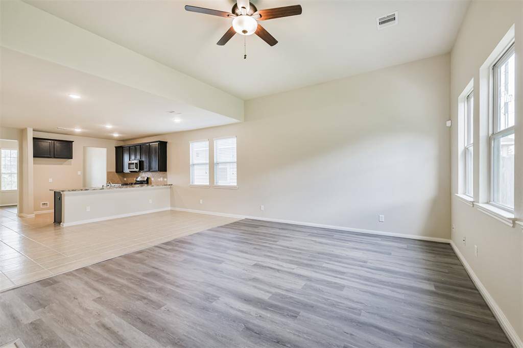 A Good Photo Perspective Showing the Overall Room Layout and Kitchen Location!