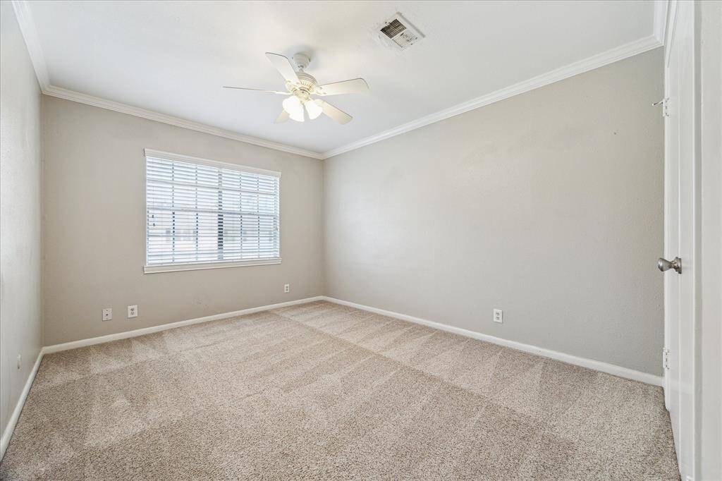 Both secondary bedrooms are located upstairs and offer fresh carpet, crown molding, and generous natural light—perfect for family, guests, or a home office.