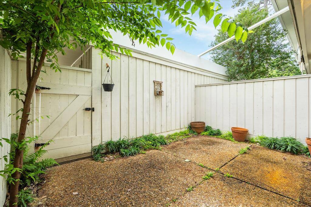 Easy maintenance landscaping and a gated entry create a charming courtyard feel with room to personalize.