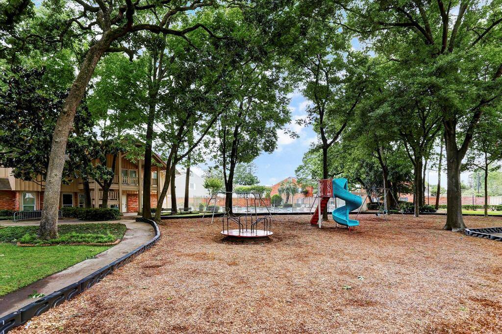 Tucked beneath mature shade trees, the community playground offers a fun and peaceful space to enjoy the outdoors just steps from home.