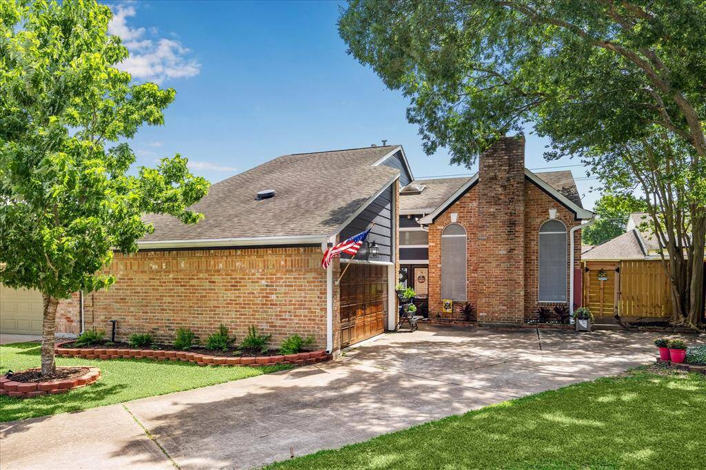Welcome to this beautifully maintained patio home featuring a 2-car attached garage with a custom-stained finish that complements the elegant front doors.
