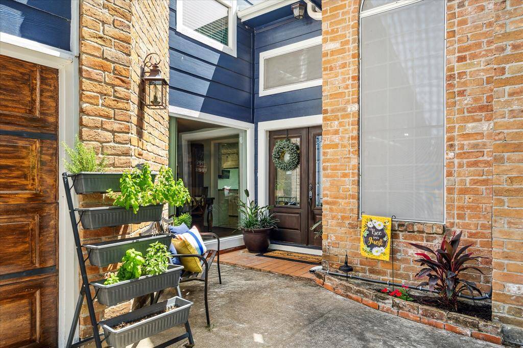 The inviting entrance boasts a glass wall and a new double glass insert front door. Designed with energy efficiency in mind, the home features attic insulation, a solar-powered attic fan, and an additional solar fan above the garage attic, ensuring year-round comfort and reduced energy costs.