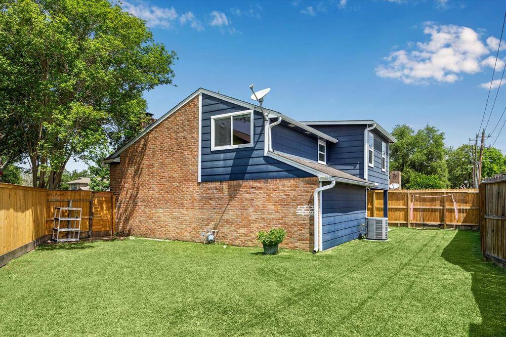 Updated fence in all three sides surrounding the backyard. The space is enhanced with high-lumen floodlights, perfect for evening gatherings and added security.
