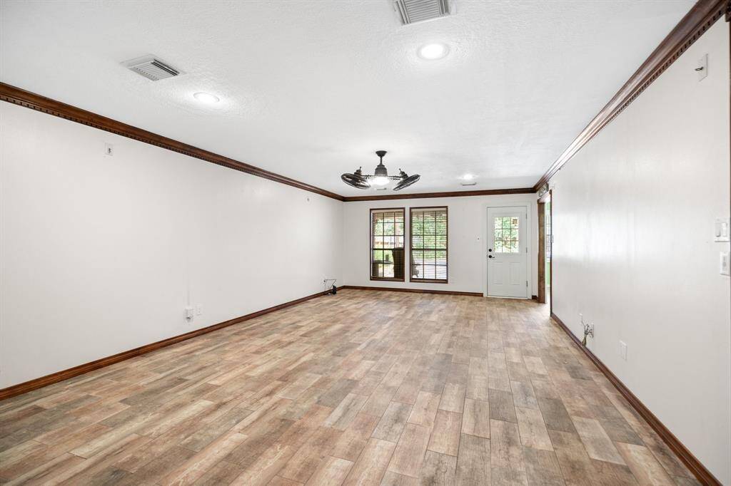 Living room overlooks back yard and pool.