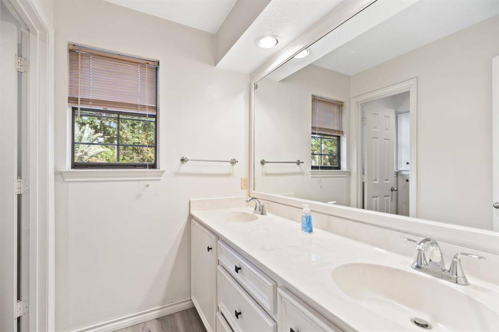 Hall bath with two sinks.