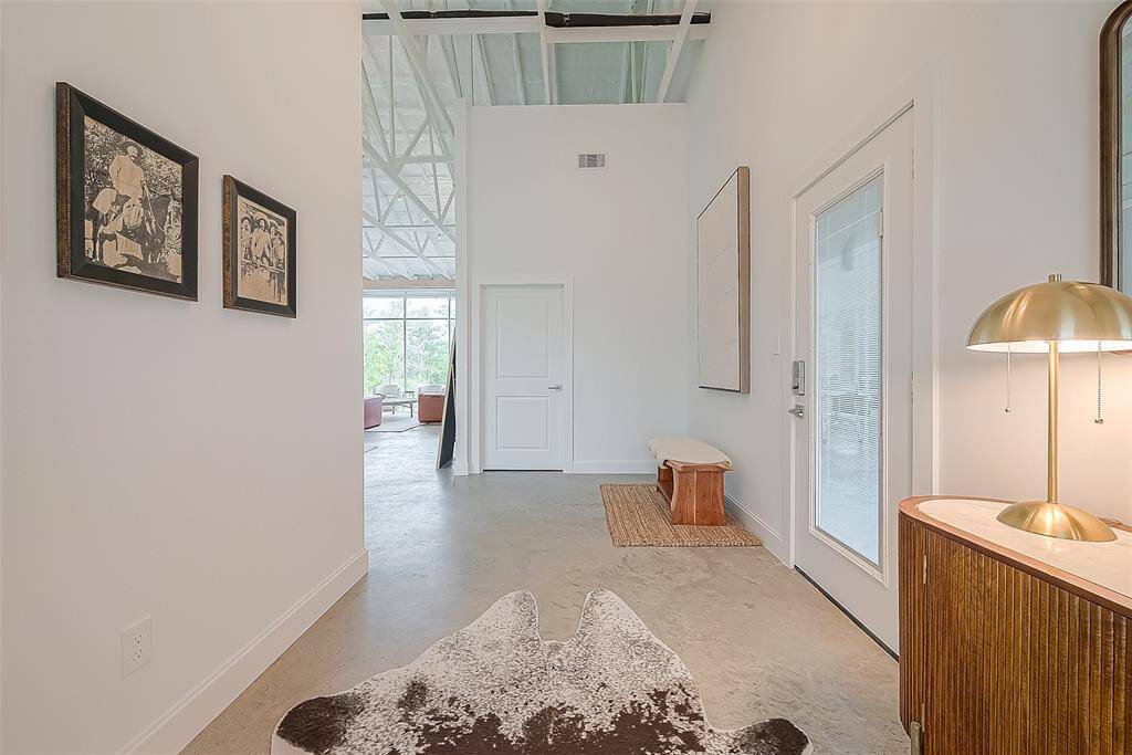 View looking in, standing at the front door. Garage door to the right.