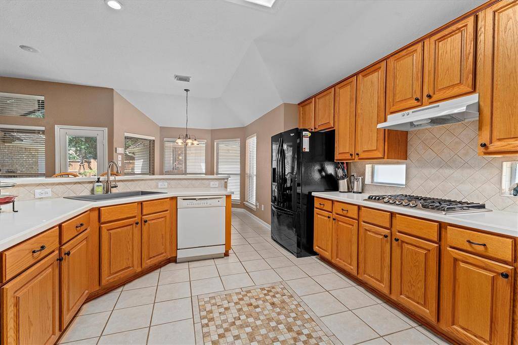 Great size kitchen!  New gas stovetop and farmhouse sink!  Refrigerator stays!