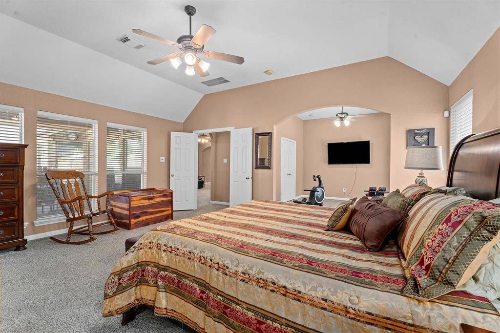 Primary Bedroom has great architectual details.  Lots of windows and great views of back patio and yard!