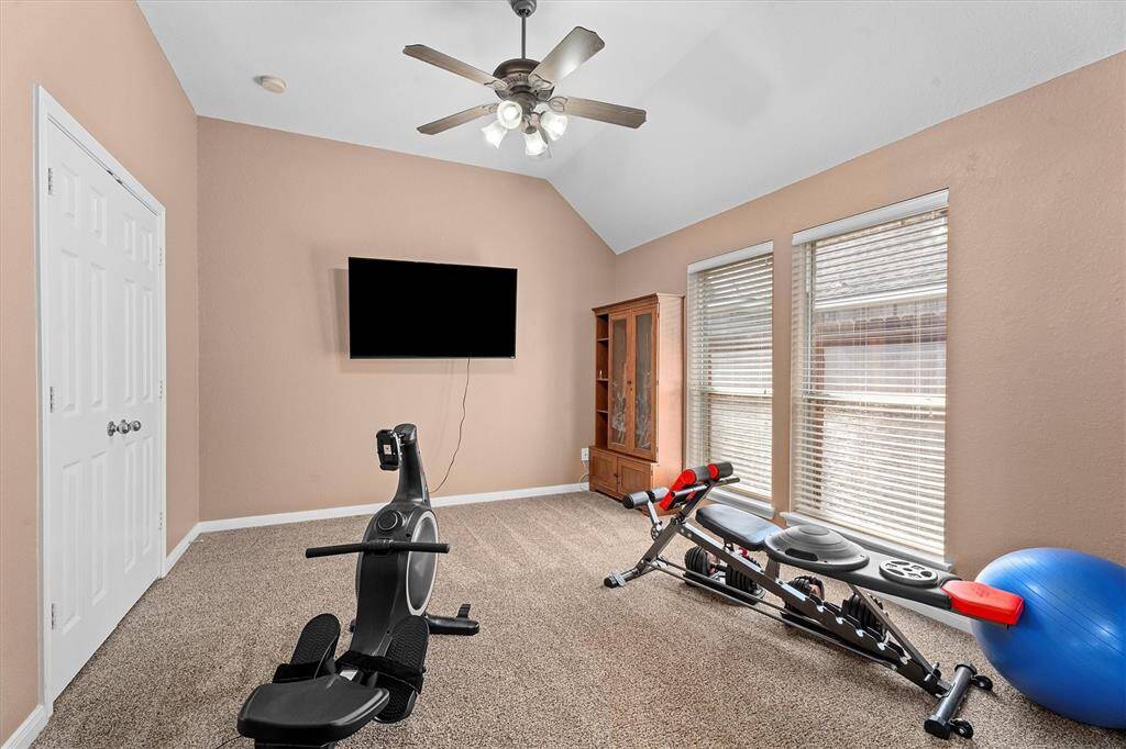 Flex space off primary bedroom is currently being used for a home gym but would make a great sitting area or nursery.