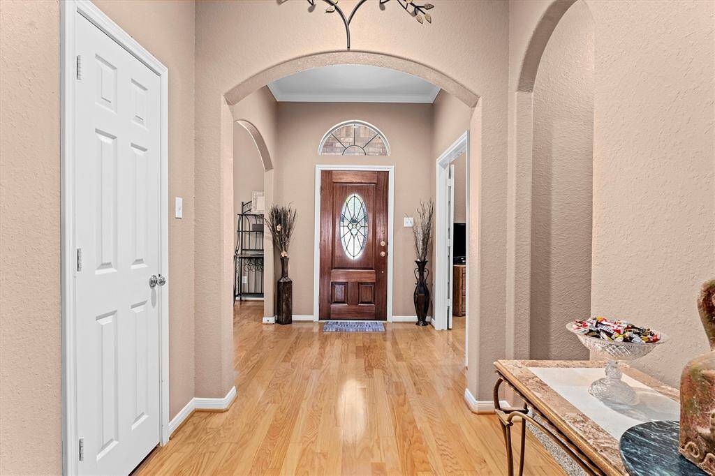 Very inviting and large entry way with high ceilings and wood floors!