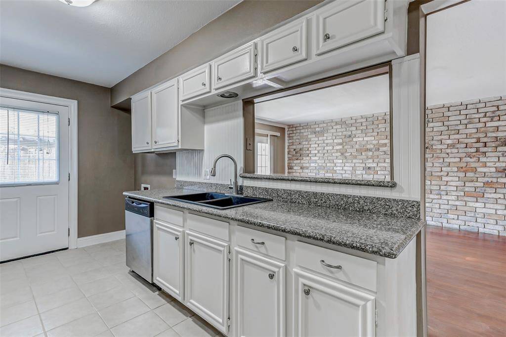 Spacious kitchen with plenty of countertop space.