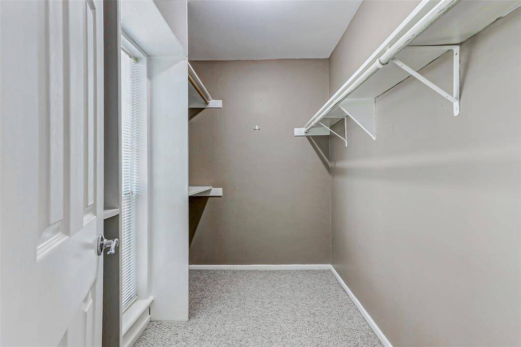 Walk-in closet in the primary bedroom.