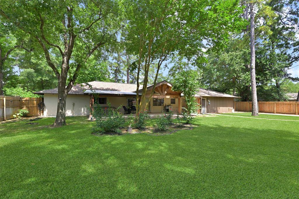 Treelined back yard with sprinkler system. Home is on well and septic.  Well depth is 250 feet and was updated in 2021. Septic Tank updated in 2018, pump replaced in 2024.