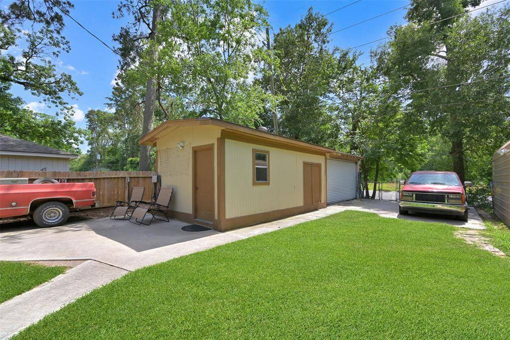 This is an amazing workshop space! Has a separate double door gated access from main driveway, two areas for parking, front and back building. Great place for a workshop, home office, storage etc.