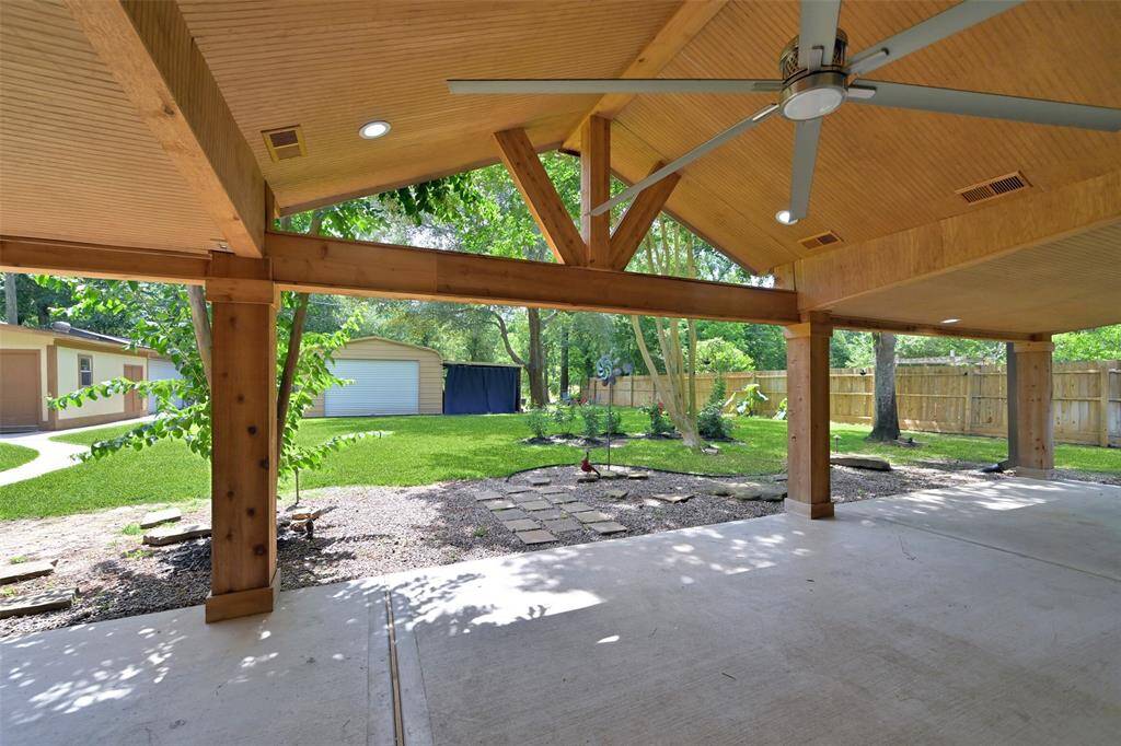 This porch is AMAZING! We love the BIG Ass FAN, Beadboard ceiling, gorgeous wood columns and design.