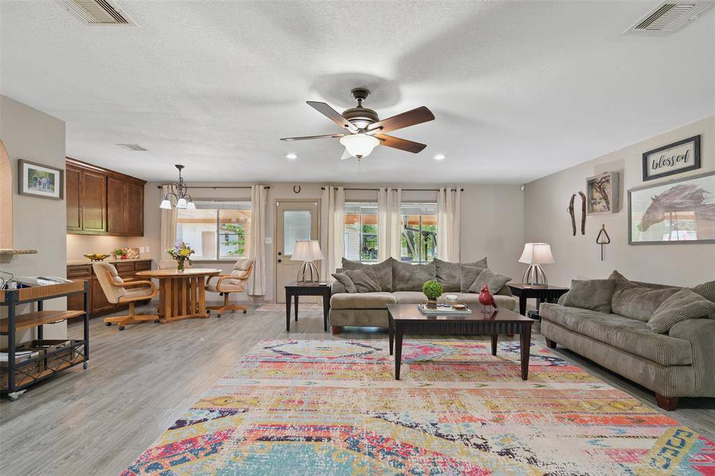 Family room overlooks back patio, is open to the kitchen and breakfast area.