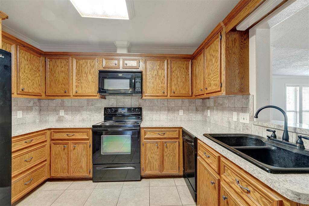 It comes fully equipped with stainless steel appliances, including an electric range and oven, dishwasher, microwave, and refrigerator.