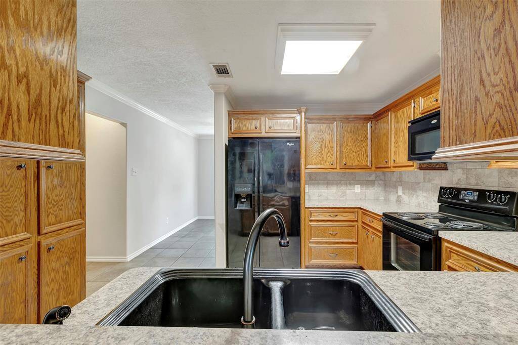 This view is from the divider with a window, separating the kitchen from the living area.