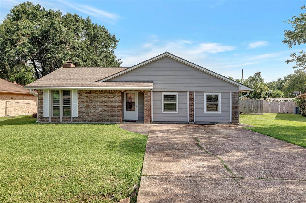The front view of the house features a private driveway for added convenience and privacy.