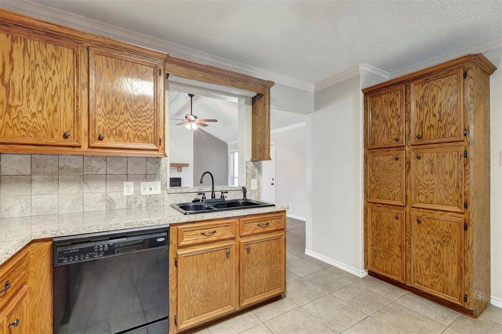 The kitchen includes generous cabinet space to help keep everything organized and within reach.