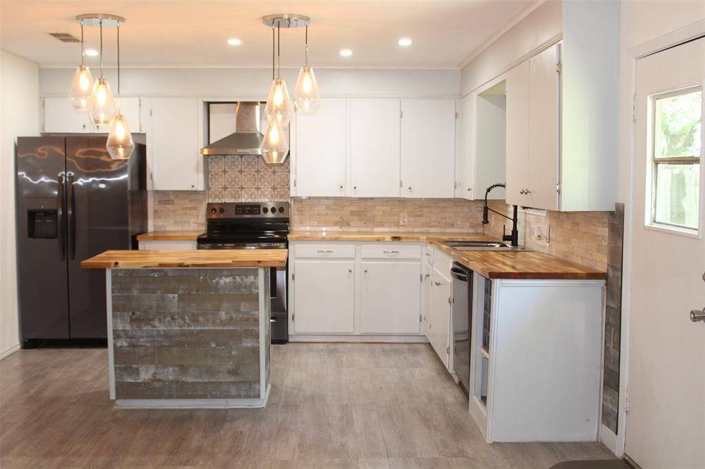 Updated Kitchen that includes all BRAND NEW Appliances.  Adorable Island creates additional work space or great place for eating & entertaining.