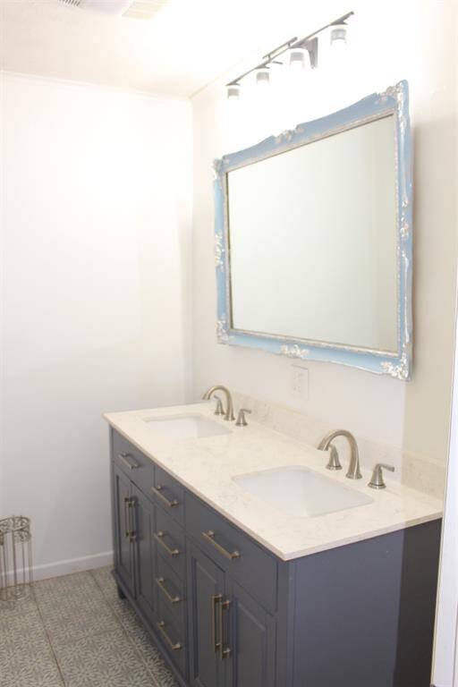 Guest Bath has a double vanity and is located just across the hall from Bedrooms 1 & 2.