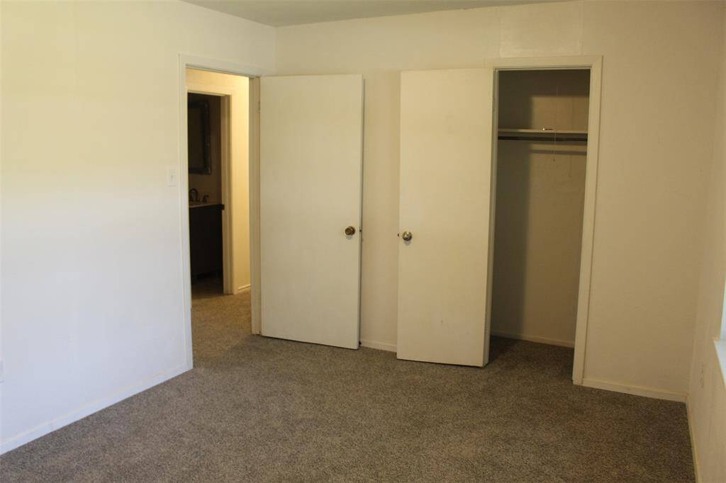 Primary Bedroom has window that overlooks backyard.
