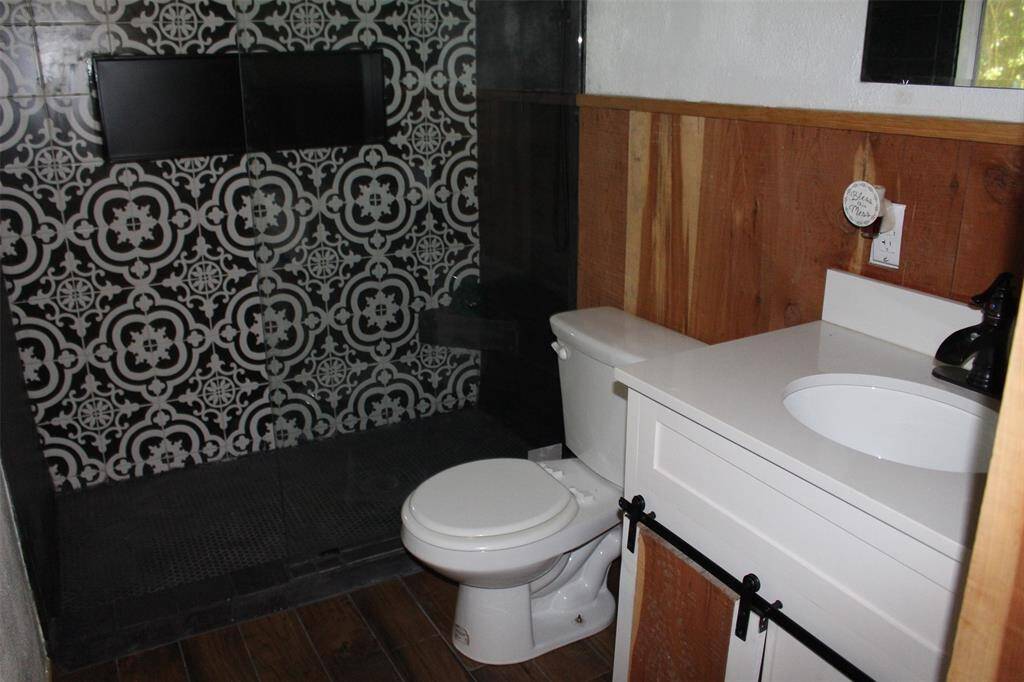 Primary Bath with barn door cabinet.