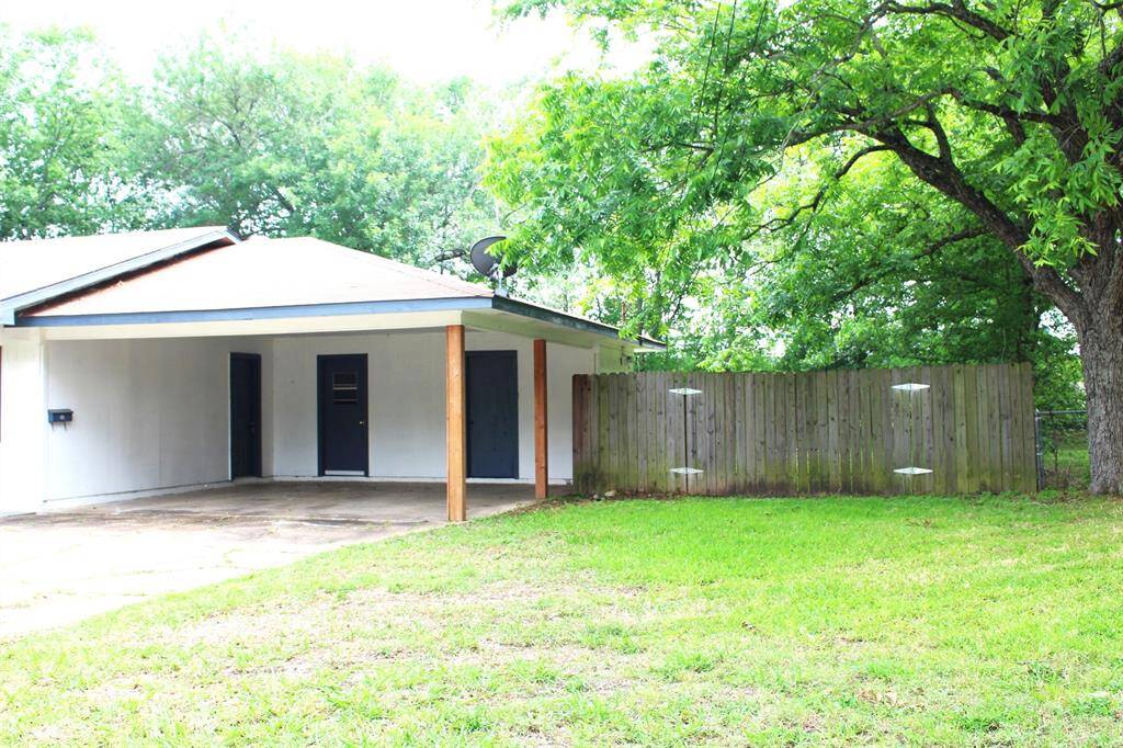 Carport and Double Gate the opens to back yard.