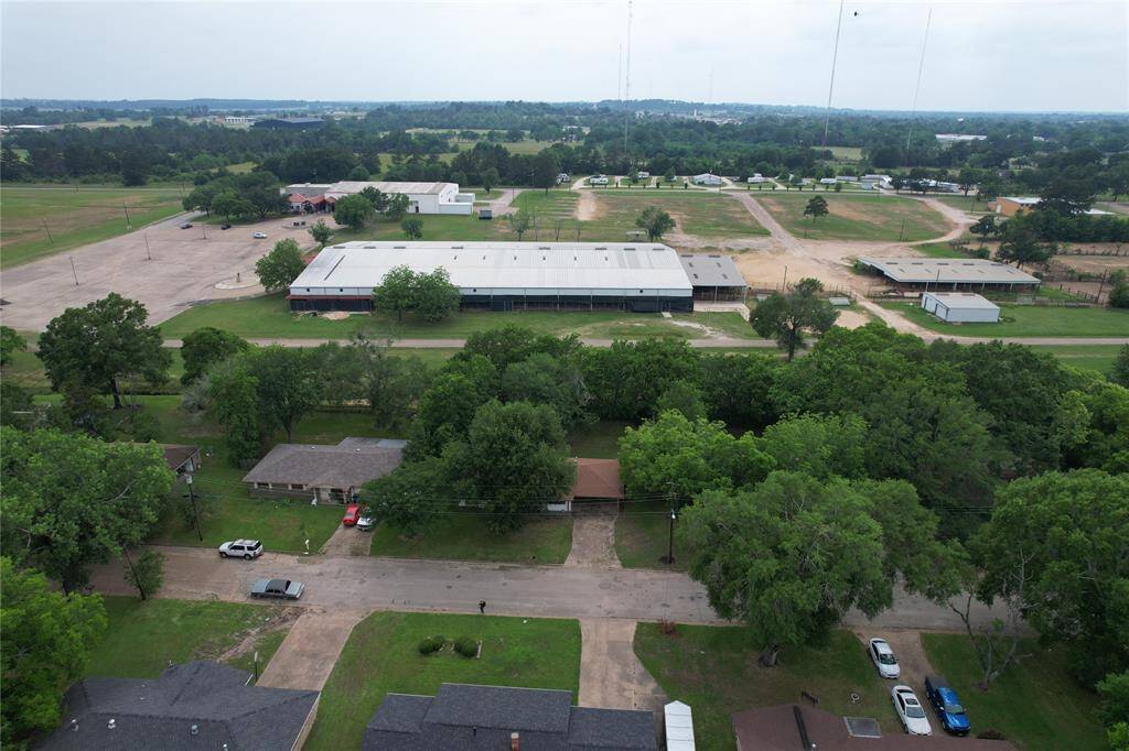 Home is in the middle with the brown roof.  The building in the back is the Porth Ag Arena. No Neighbors behind you.