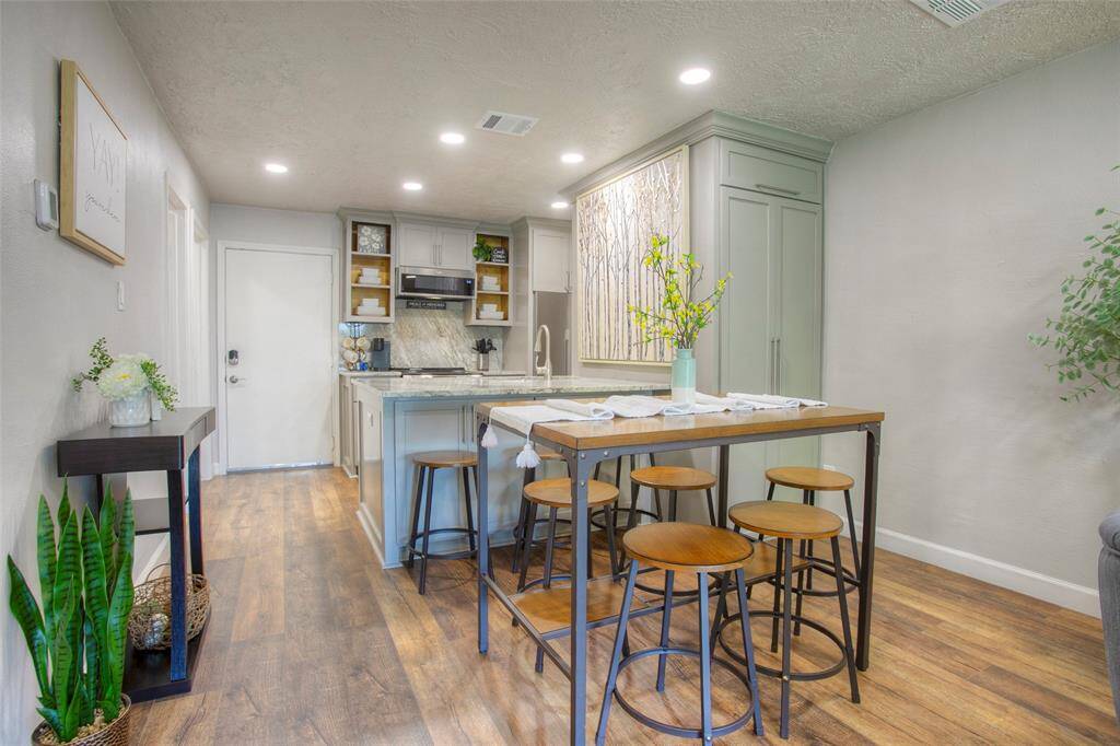 The front door opens into the beautiful kitchen and dining room.The washer and dryer are behind the double doors