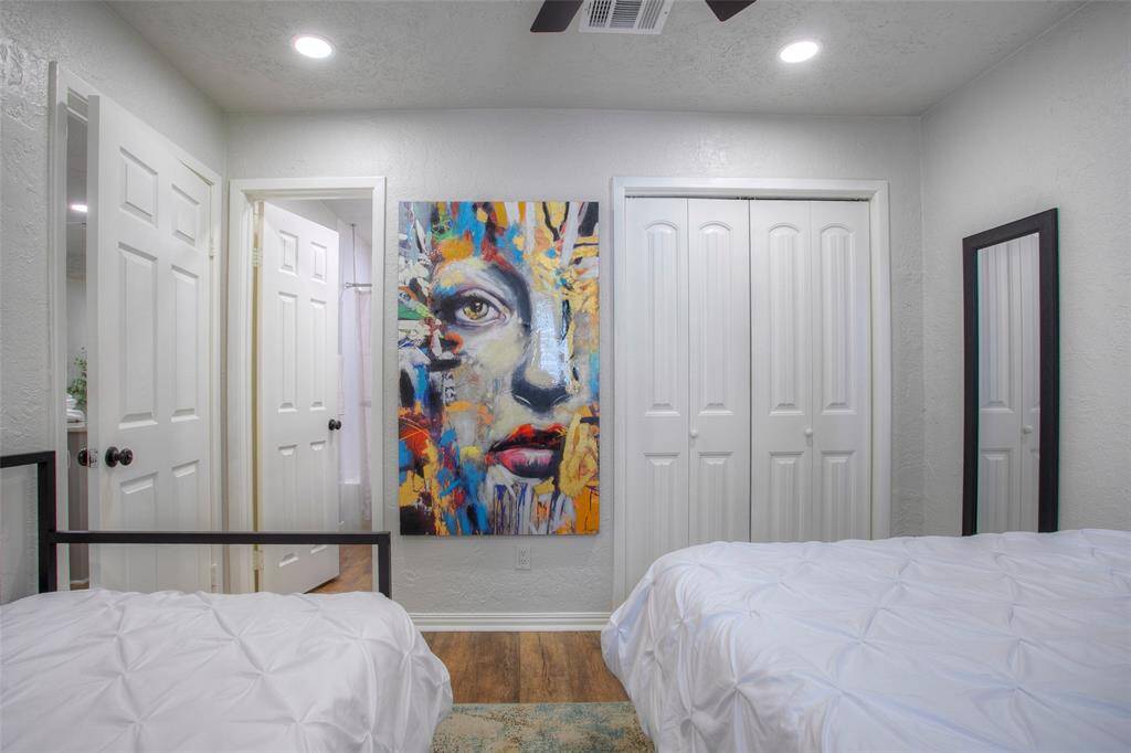 Here is another view of the guest bedroom with a door into the guest bathroom