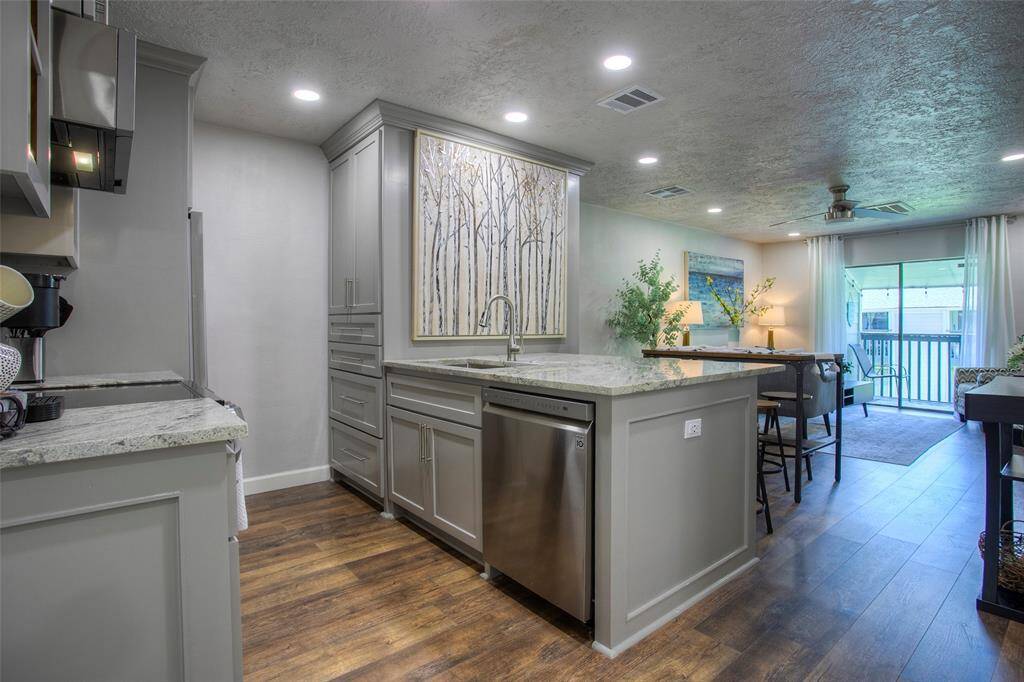 The kitchen is open to the living and dining areas.