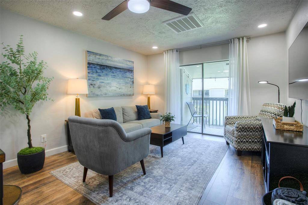 The living area with access to the balcony.