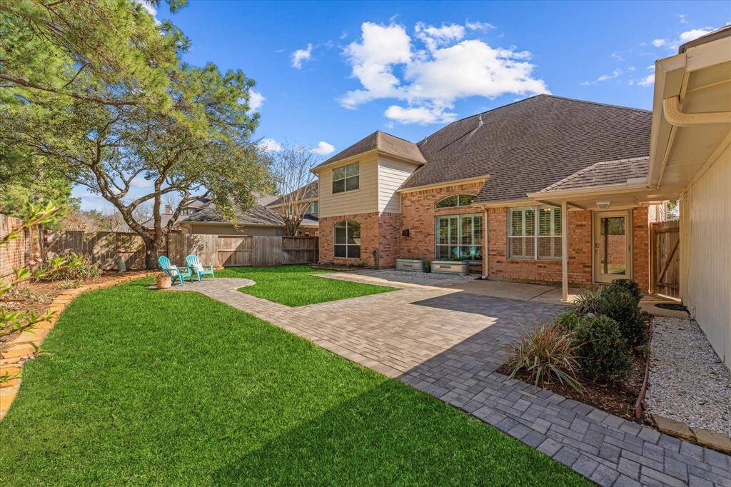 Beautiful back yard with custom pavers and landscaping