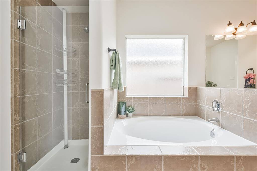 Large soaking tub and separate shower.