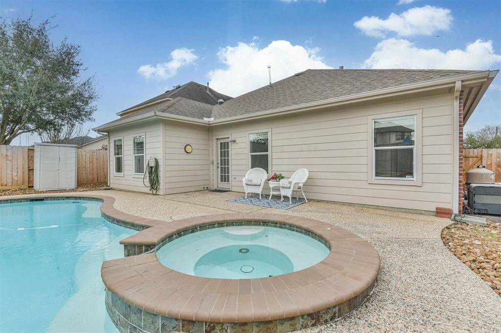 Storage shed pictured can stay. Great for pool toys.