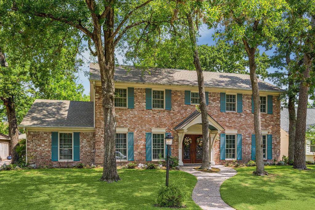 This truly special home is loaded with character and timeless charm. Beautiful mature trees shade the front lawn, creating a picturesque setting that welcomes you home. A classic covered front porch with striking double beveled glass doors sets the tone for what’s inside.