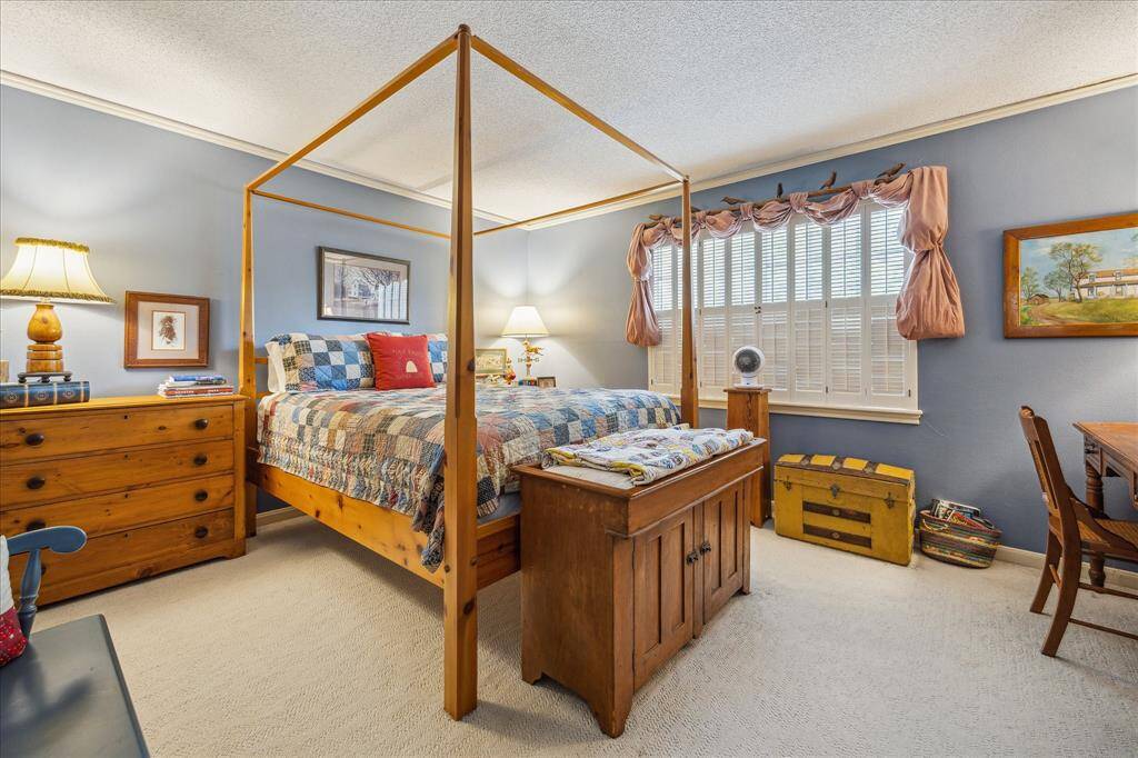 This secondary bedroom is a personal retreat, boasting a walk-in closet and room for a sitting area or workspace, providing ample storage space while adding a touch of convenience.
