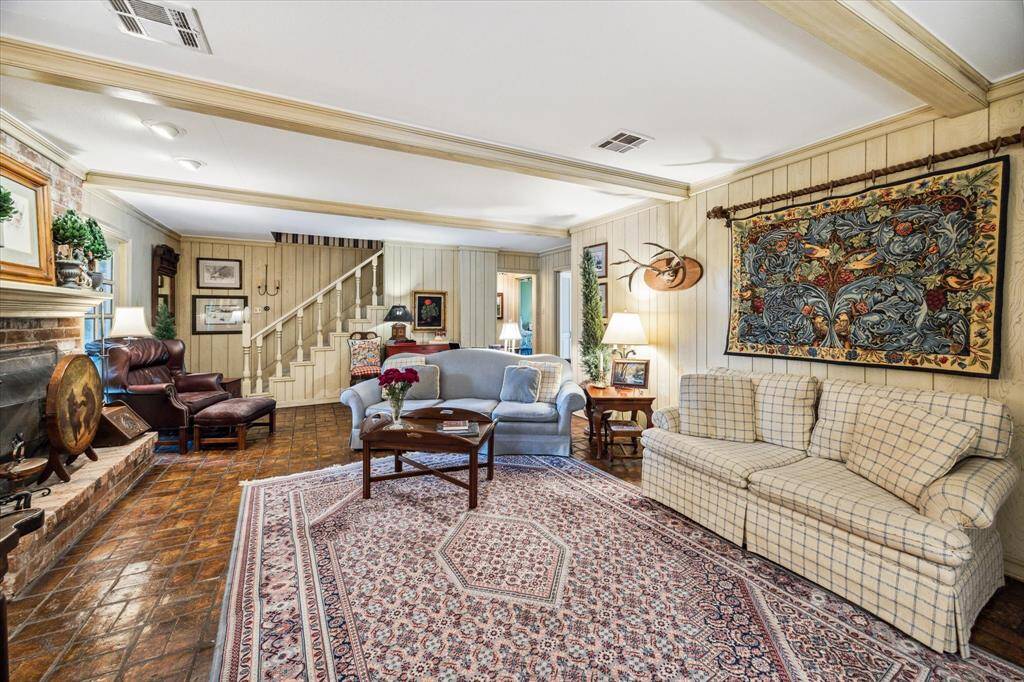 Alternate view showing the discreet entry to the primary suite, allowing for both convenience and privacy. Altogether, this family room is a stunning fusion of design, comfort, and connectivity—truly the heart of the home.