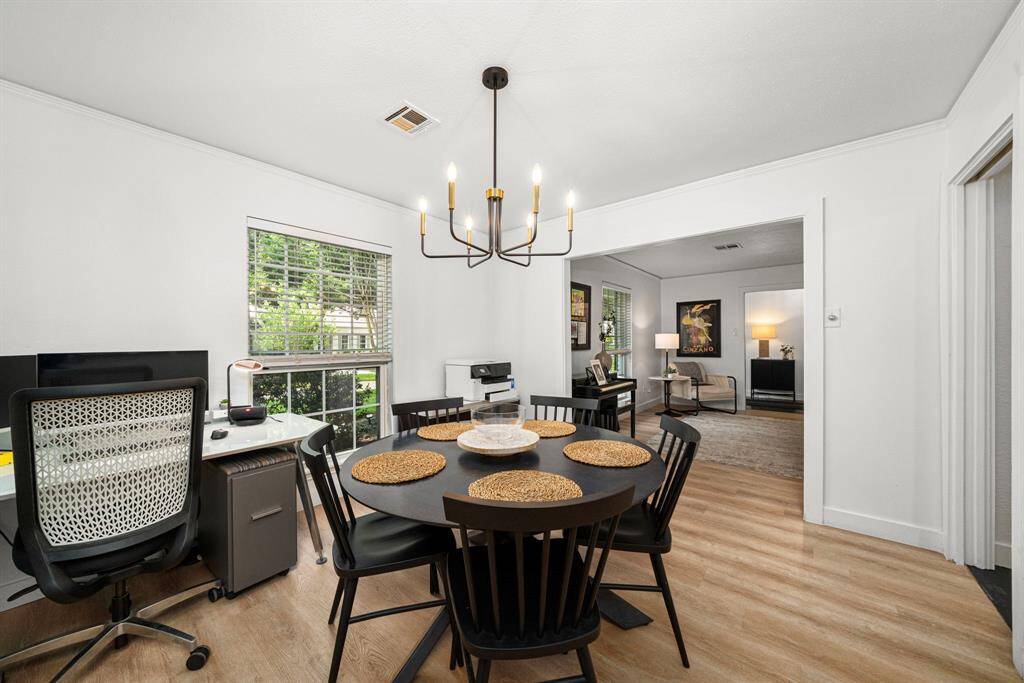 Viewing flow from entry to living room to dining room to kitchen on right