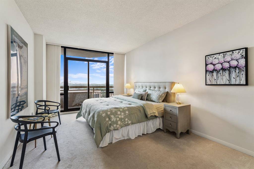 Primary suite with balcony access.