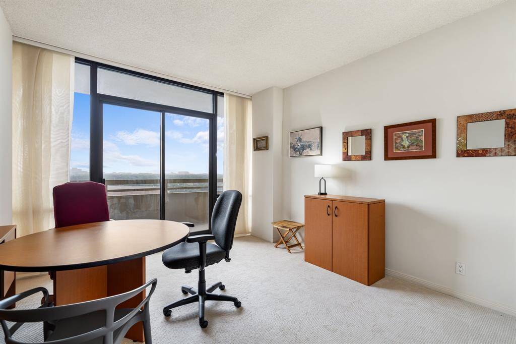 Second bedroom with balcony access.