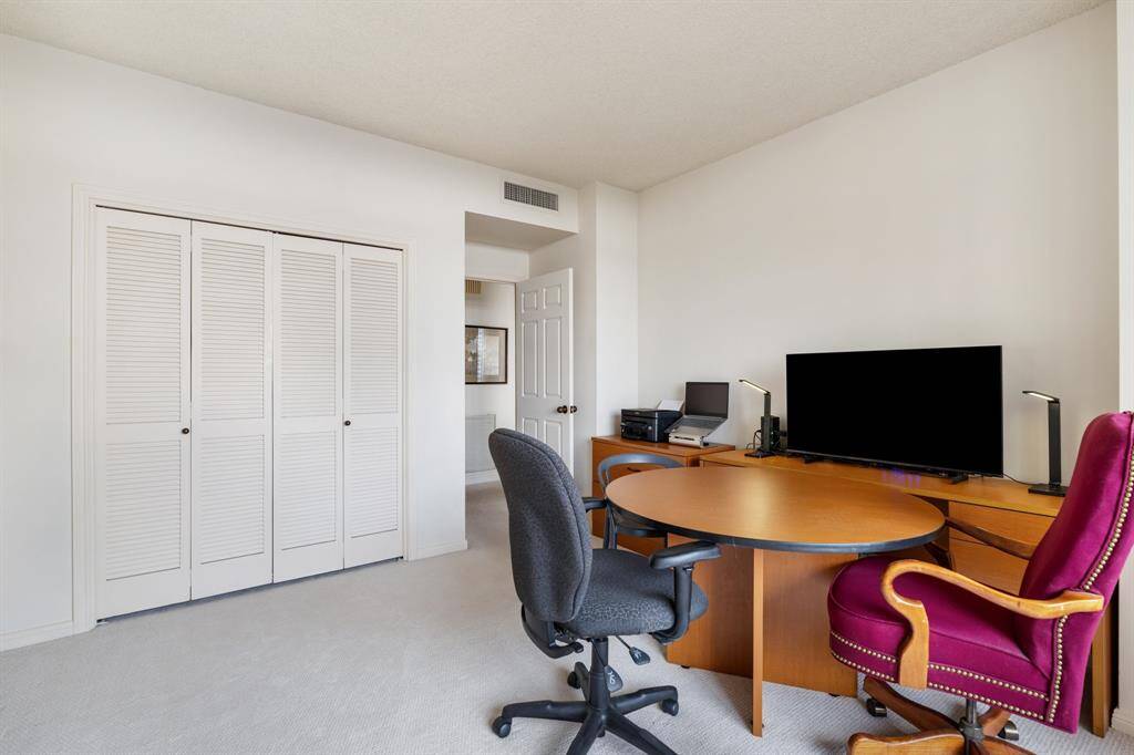 Second bedroom makes a great home office or den.