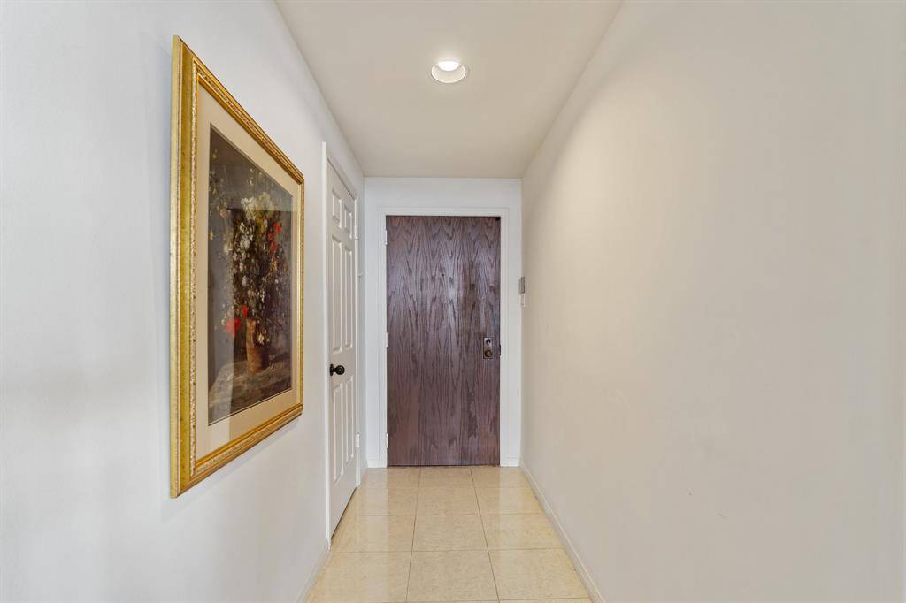 Entry with coat closet and a walk-in storage closet.