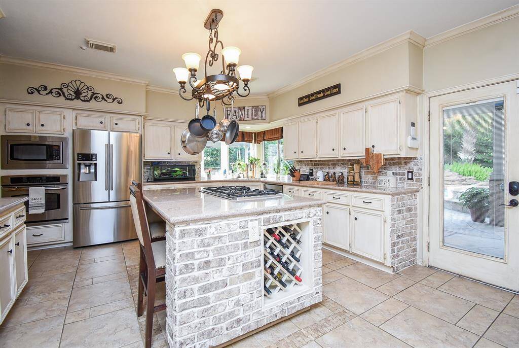 brick backsplash along with brick island
