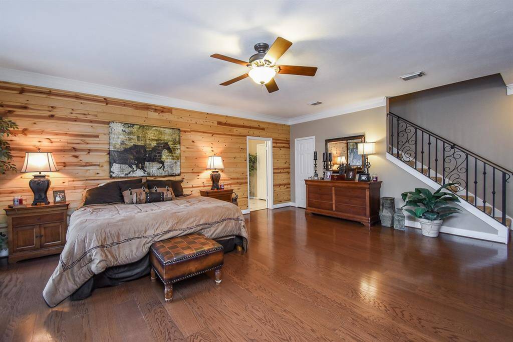 Massive Primary Bedroom. Notice rear staircase leading to theater room.