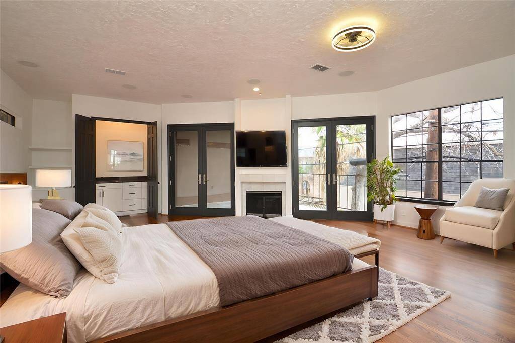 This gorgeous primary suite has a fireplace, coffee bar, and patio!