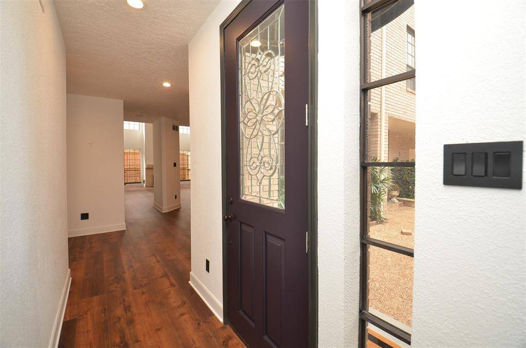 A cheerful and bright entry foyer. New flooring on the first floor.
