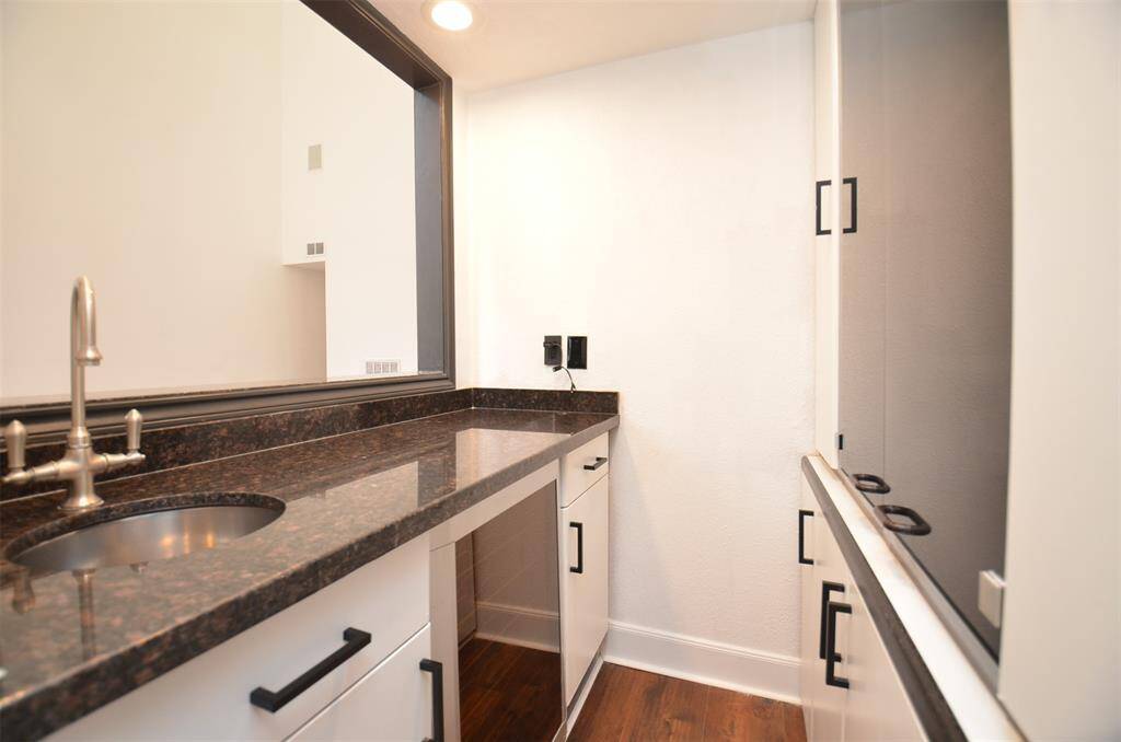 The wet bar connects to the living room and dining room